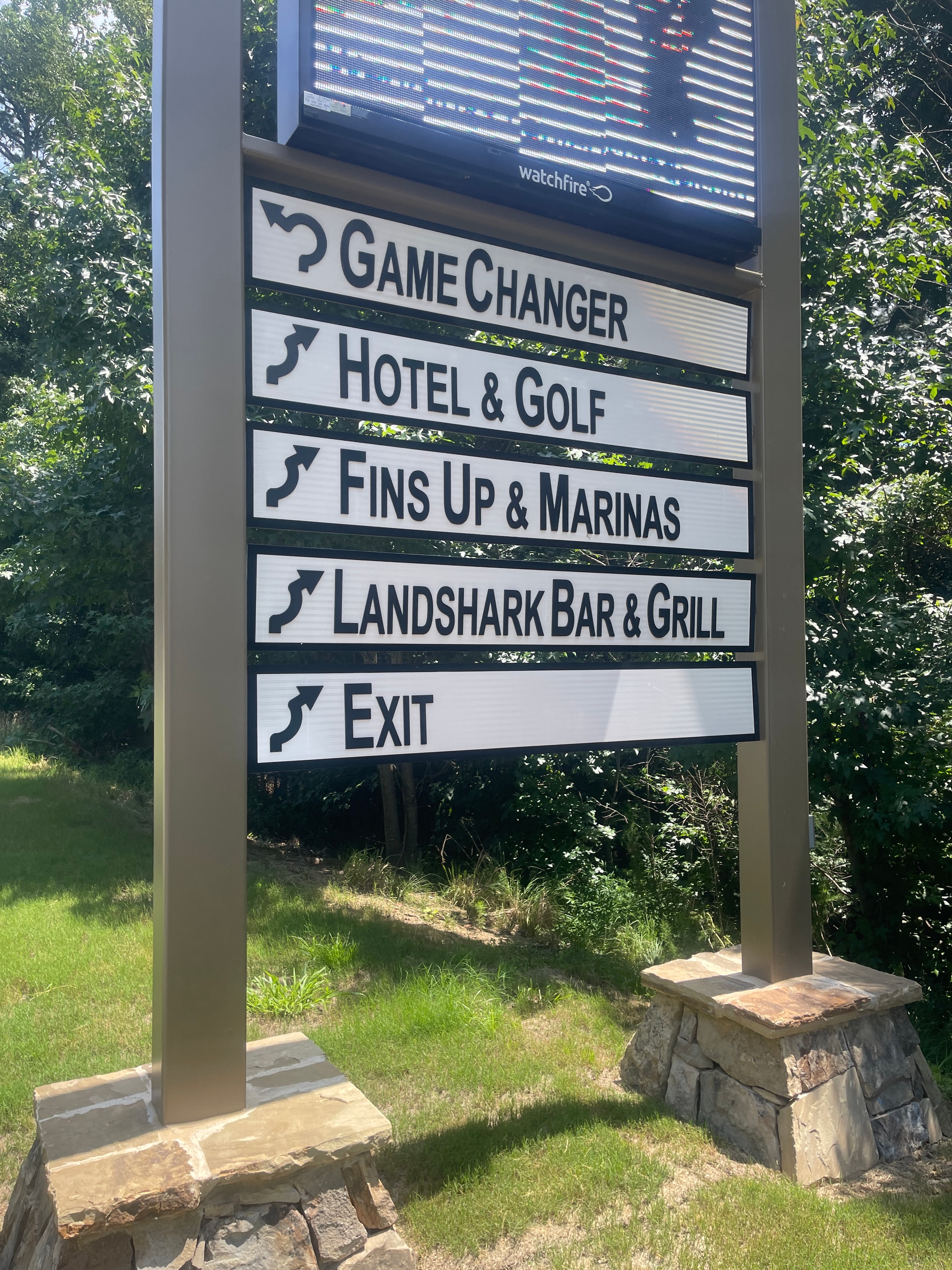 Margaritaville resort wayfinding directional sign system with Game Changer, Hotel and Golf, Fins Up, Landshark Bar and Grill, and Exit panels