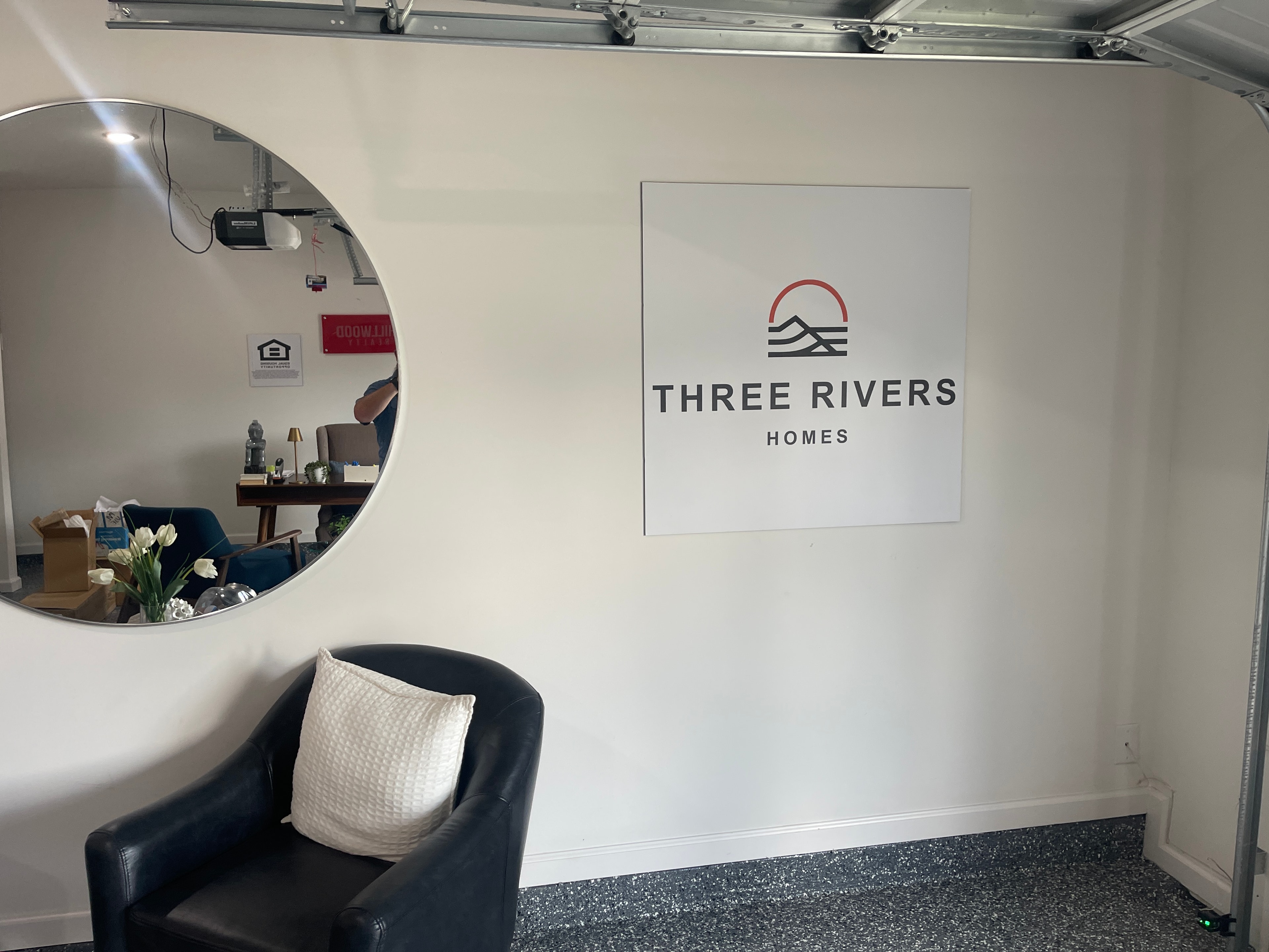 Three Rivers Homes large format wall sign with logo in real estate sales office